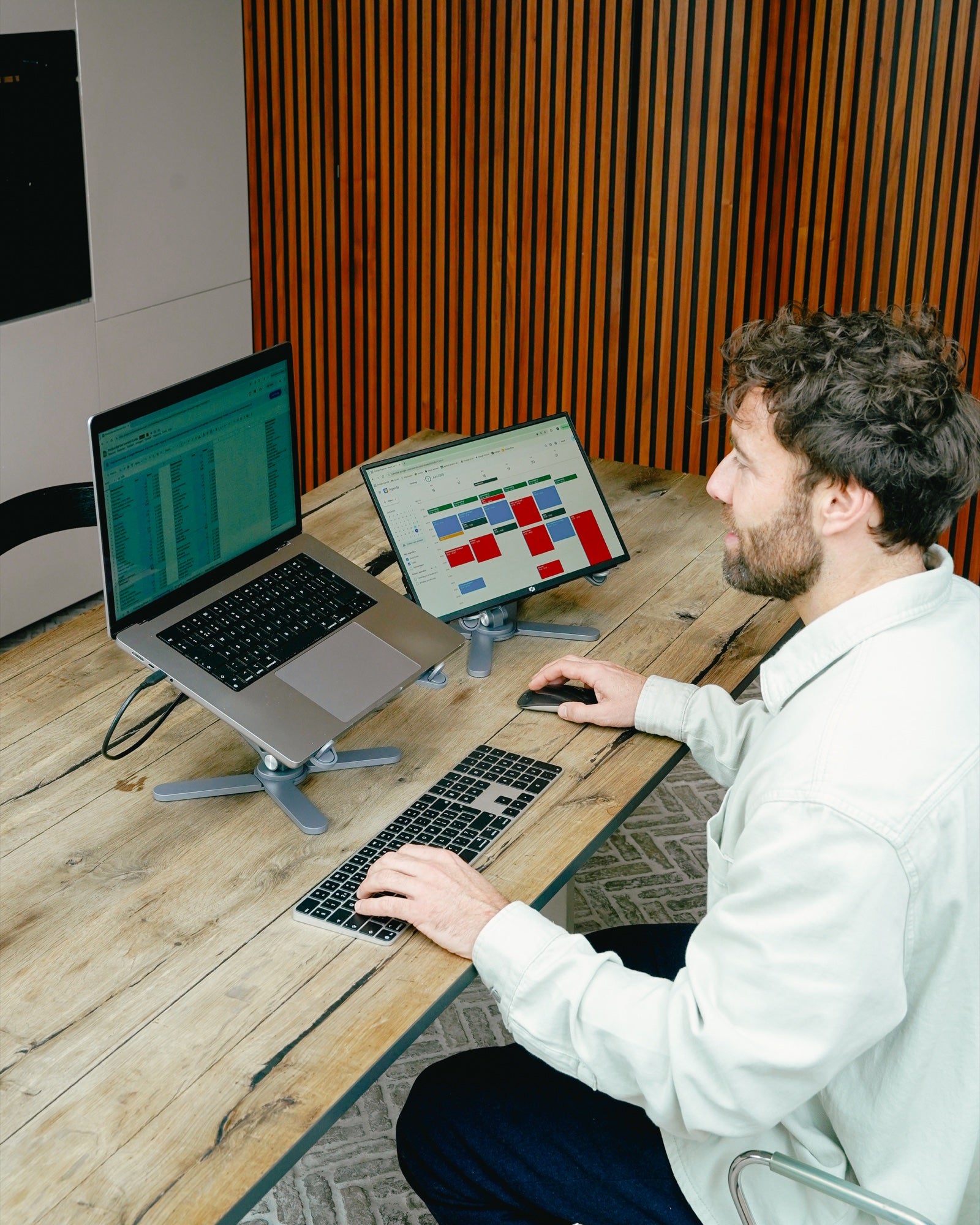 DeskStand set up for a workspace with a laptop and an additional monitor — Gray