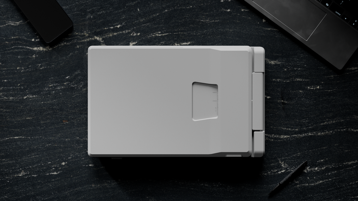 Dual Flip 16″ — Ingeklapte Screenmate Dual Flip van bovenaf gezien op een donker bureau