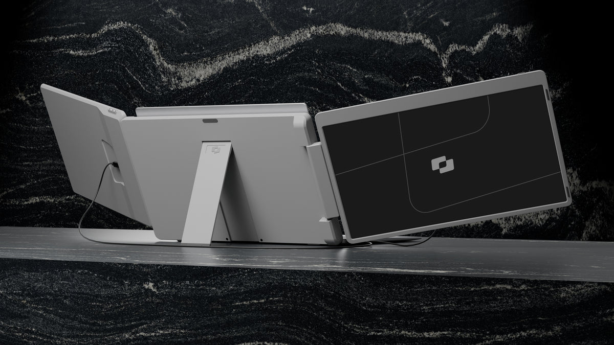 Flip 15.6″ — Screenmate Flip viewed from the back, with one side screen folded forward and the stand visible
