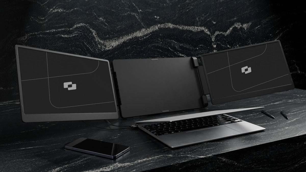 Flip 15.6″ — Screenmate Flip placed behind a laptop with two side screens open